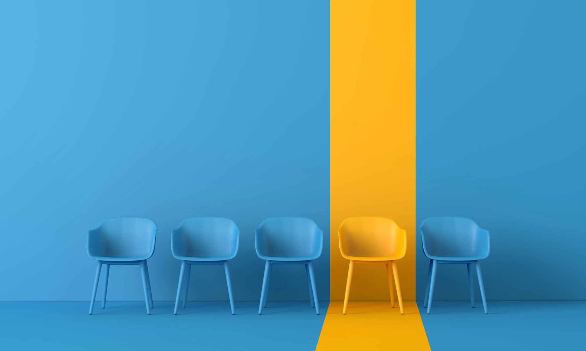 A row of blue chairs with one yellow chair standing out